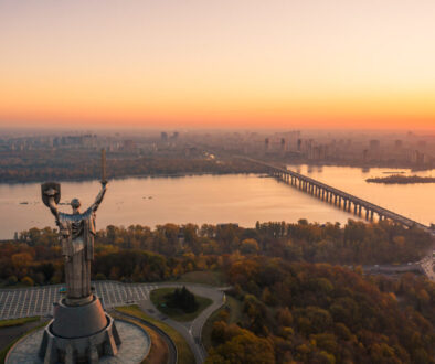 Kiev skyline over beautiful fiery sunset, Ukraine. Monument motherland.